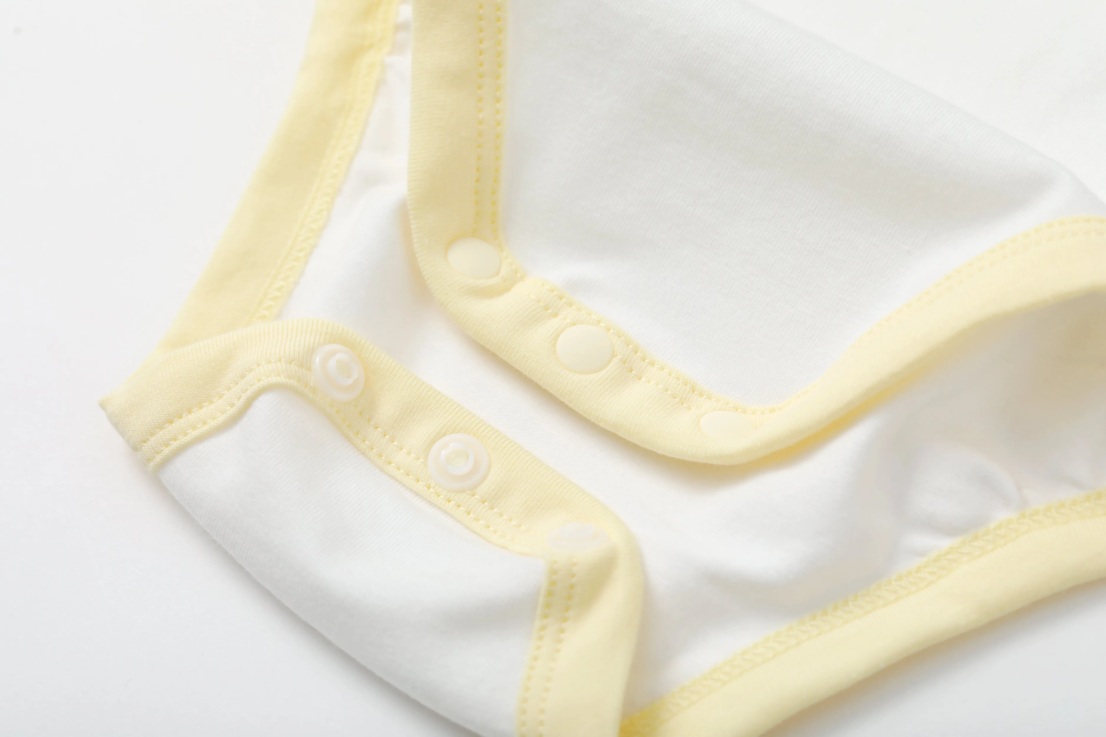 Vauva BBNS - Organic Cotton White/Light Yellow Bodysuits (2-pack)